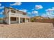 Spacious home backyard featuring a second-story balcony and low maintenance landscaping at 12023 W Duane Ln, Peoria, AZ 85383