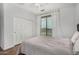 Bedroom featuring a closet, balcony access, and bright atmosphere at 12023 W Duane Ln, Peoria, AZ 85383