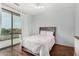 Inviting bedroom with a plush bed, balcony access, and a bright, airy atmosphere at 12023 W Duane Ln, Peoria, AZ 85383