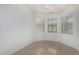 Bright bedroom with natural light, tile floors, and neutral walls, creating a cozy and serene atmosphere at 12023 W Duane Ln, Peoria, AZ 85383