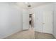 Minimalist bedroom featuring tile floors, neutral walls, and an open doorway, creating a clean and inviting space at 12023 W Duane Ln, Peoria, AZ 85383