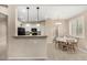 Bright dining area with a breakfast table flows into the kitchen, creating a seamless living space at 12023 W Duane Ln, Peoria, AZ 85383