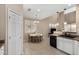Well-lit dining area with white walls connects to a modern kitchen with granite countertops at 12023 W Duane Ln, Peoria, AZ 85383