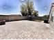 Private backyard featuring paver stones, artificial turf, and mature landscaping at 1339 W Mesquite Ave, Apache Junction, AZ 85120