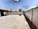 Spacious backyard featuring pavers, block wall, and potential for outdoor activities at 1339 W Mesquite Ave, Apache Junction, AZ 85120