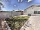 Charming backyard with brick pavers, green grass, providing a serene outdoor space at 1339 W Mesquite Ave, Apache Junction, AZ 85120