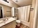 Neutral bathroom featuring vanity with sink, mirrored cabinet, toilet, and shower with curtain at 1339 W Mesquite Ave, Apache Junction, AZ 85120