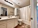 Neutral bathroom featuring vanity with sink, mirrored cabinet, toilet, and shower with curtain at 1339 W Mesquite Ave, Apache Junction, AZ 85120
