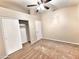 Bedroom featuring plush carpet flooring, closet, and ceiling fan for added comfort at 1339 W Mesquite Ave, Apache Junction, AZ 85120