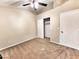 Bedroom featuring plush carpet flooring, closet, and ceiling fan for added comfort at 1339 W Mesquite Ave, Apache Junction, AZ 85120