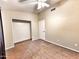 Bedroom featuring plush carpet flooring, closet, and ceiling fan for added comfort at 1339 W Mesquite Ave, Apache Junction, AZ 85120