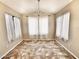 Bright dining room featuring a chandelier, tile floor, and bright natural lighting at 1339 W Mesquite Ave, Apache Junction, AZ 85120