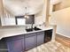 Modern kitchen with a stainless steel sink, black faucet, white countertop, and gray cabinets at 1339 W Mesquite Ave, Apache Junction, AZ 85120