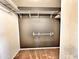 Walk-in closet features neutral carpet, painted walls, and metal racks for storage at 1339 W Mesquite Ave, Apache Junction, AZ 85120