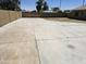 Expansive concrete backyard, fully enclosed with block fencing, offering ample space for various outdoor activities and entertaining at 13801 N 37Th Dr, Phoenix, AZ 85053