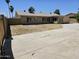 Large concrete backyard with block fencing, showcasing outdoor space for recreation and relaxation at 13801 N 37Th Dr, Phoenix, AZ 85053