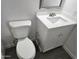 Updated bathroom featuring a white toilet, new vanity, and modern finishes at 13801 N 37Th Dr, Phoenix, AZ 85053