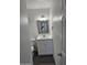 Bathroom featuring white vanity, new fixtures, and modern lighting at 13801 N 37Th Dr, Phoenix, AZ 85053