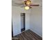 Bedroom showcasing a ceiling fan and a closet with sliding doors at 13801 N 37Th Dr, Phoenix, AZ 85053