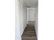 Hallway with wood flooring and closet on the left side at 13801 N 37Th Dr, Phoenix, AZ 85053