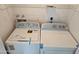 Laundry room with washer, dryer, and overhead shelving for storage at 13801 N 37Th Dr, Phoenix, AZ 85053