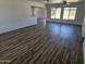 Spacious living room featuring sleek hardwood floors and abundant natural light at 13801 N 37Th Dr, Phoenix, AZ 85053