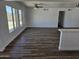 Spacious living area with wood flooring, white walls, and lots of natural light at 13801 N 37Th Dr, Phoenix, AZ 85053