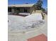 Residential home showcasing a concrete driveway and landscaped areas on the side of the property at 13801 N 37Th Dr, Phoenix, AZ 85053