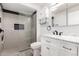 Modern bathroom features updated vanity, marble countertop, and walk-in shower at 14224 N Newcastle Dr, Sun City, AZ 85351