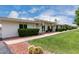 Well-maintained exterior with neatly trimmed bushes and a tidy green lawn at 14224 N Newcastle Dr, Sun City, AZ 85351