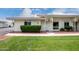 Charming single-story home with a well-manicured lawn and inviting front entrance at 14224 N Newcastle Dr, Sun City, AZ 85351