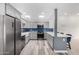 Modern kitchen featuring stainless steel appliances and stylish blue backsplash at 14224 N Newcastle Dr, Sun City, AZ 85351