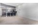 Bright, open-concept living area with bar and modern kitchen at 14224 N Newcastle Dr, Sun City, AZ 85351