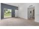 Open living area with view of yard, neutral walls and carpet at 14224 N Newcastle Dr, Sun City, AZ 85351