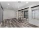 Bright living room featuring wood floors, recessed lighting, and sliding glass doors at 14224 N Newcastle Dr, Sun City, AZ 85351