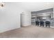 Bright, open-concept living area with bar and modern kitchen at 14224 N Newcastle Dr, Sun City, AZ 85351