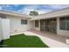 Back patio featuring a small patch of artificial grass, and a private entrance at 14224 N Newcastle Dr, Sun City, AZ 85351