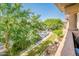 Scenic view from the balcony showcasing lush landscaping and convenient parking at 14950 W Mountain View Blvd # 5306, Surprise, AZ 85374
