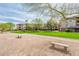 Exterior view of the multi-story building with expansive lawn at 14950 W Mountain View Blvd # 5306, Surprise, AZ 85374