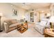 Cozy living room featuring a sofa, recliner, and built-in shelving for storage and decor at 14950 W Mountain View Blvd # 5306, Surprise, AZ 85374