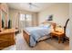 Comfortable bedroom features natural light, soft carpet, and a coordinated furniture set at 14950 W Mountain View Blvd # 5306, Surprise, AZ 85374