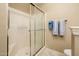 Clean bathroom featuring shower with glass door and coordinated towel set at 14950 W Mountain View Blvd # 5306, Surprise, AZ 85374