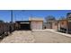 Spacious backyard featuring desert landscaping, shed, and ample room for outdoor activities and entertainment at 1586 S Lawther Dr, Apache Junction, AZ 85120