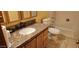 Bathroom featuring granite countertop, tile floors, toilet, tub and shower at 1586 S Lawther Dr, Apache Junction, AZ 85120
