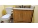 Bathroom with tiled floor, toilet, and vanity with oak-colored cabinet and granite countertop at 1586 S Lawther Dr, Apache Junction, AZ 85120