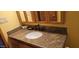 Bathroom featuring granite countertop vanity, modern faucet and wood trim mirror at 1586 S Lawther Dr, Apache Junction, AZ 85120