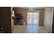A large dining area with tile floors, stainless steel appliances, and a chandelier at 1586 S Lawther Dr, Apache Junction, AZ 85120