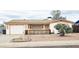 Charming single-story home featuring desert landscaping, a welcoming front porch, and an attached garage at 1586 S Lawther Dr, Apache Junction, AZ 85120