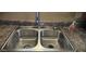 Close-up of the stainless steel kitchen sink with a modern faucet and soap dispenser at 1586 S Lawther Dr, Apache Junction, AZ 85120