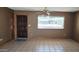 Living room with tile flooring, neutral paint, and natural light from a large window at 1586 S Lawther Dr, Apache Junction, AZ 85120